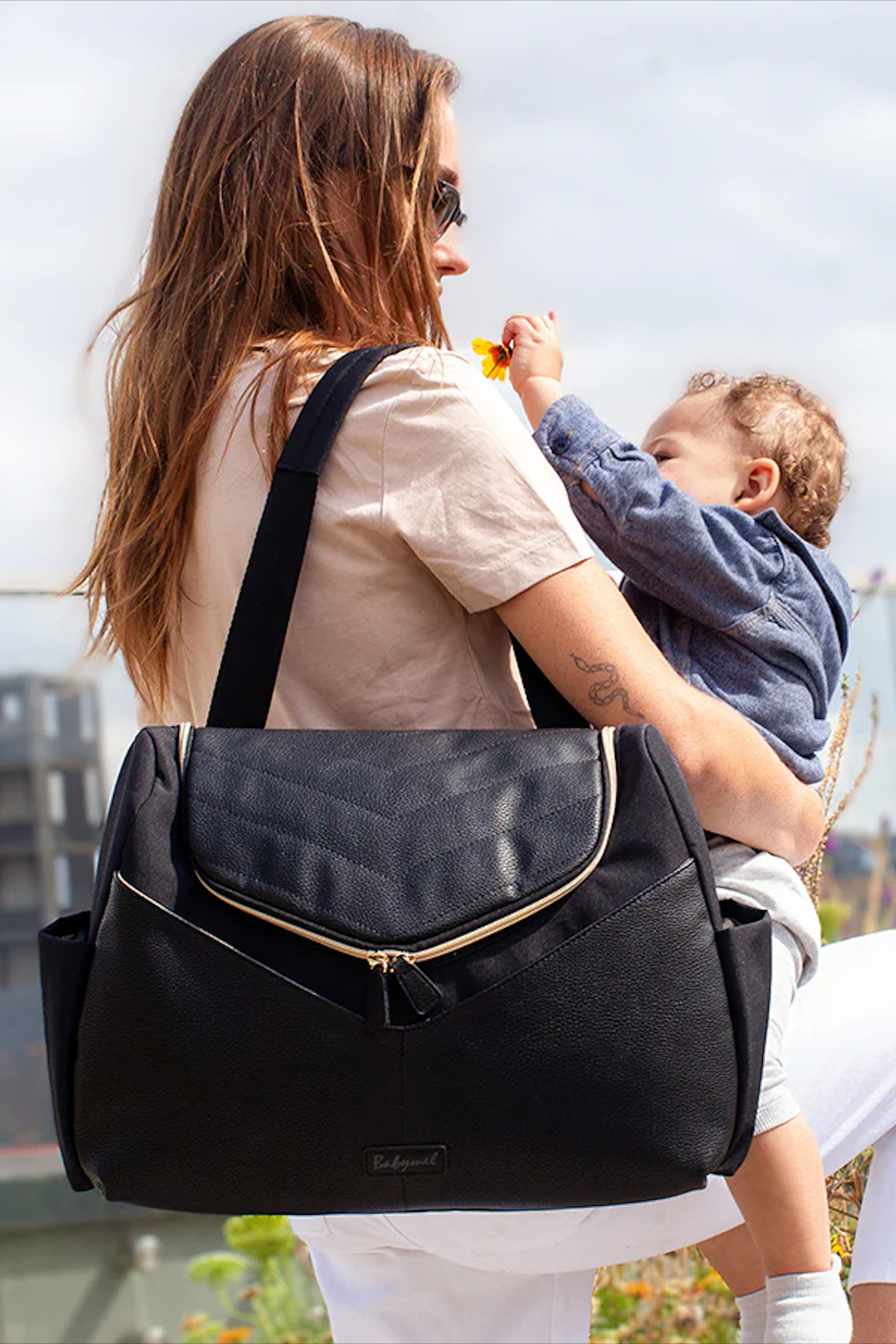 Babymel Wickeltasche und Rucksack aus veganem Kunstleder schwarz online  kaufen | Mamarella