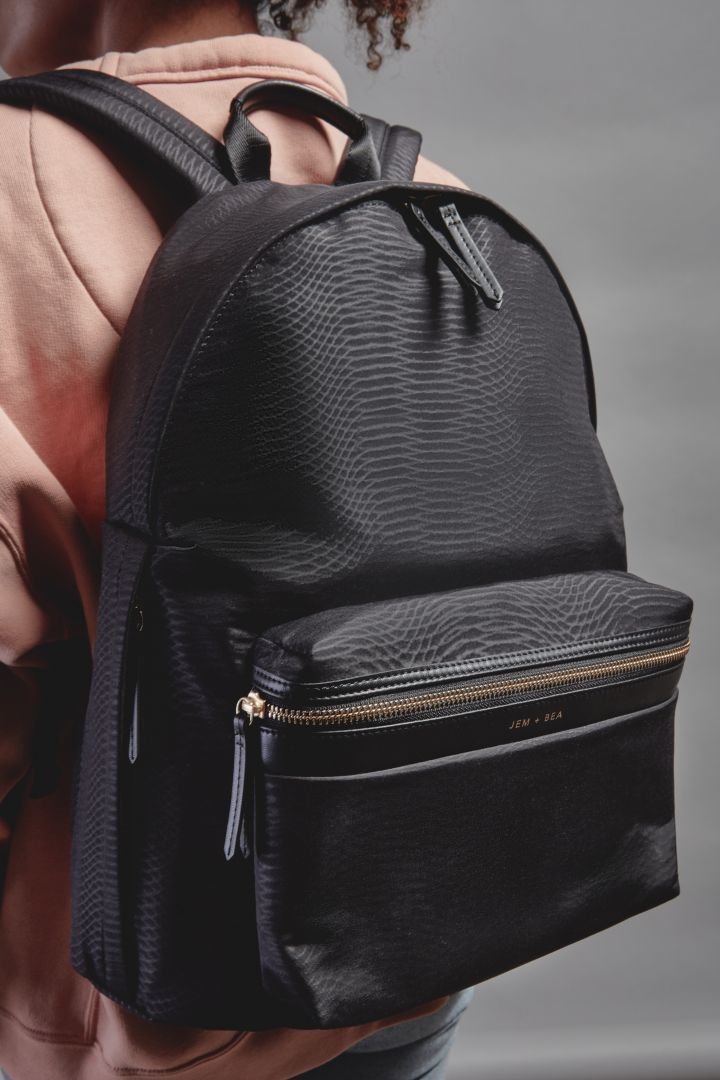 Baby-Changing Backpack with a Python Look black